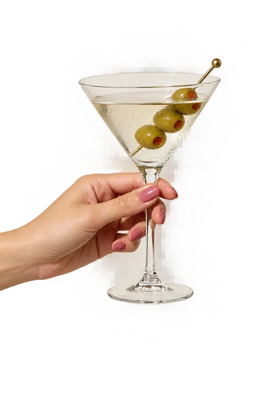 Hand with pink nails holding a dirty martini
